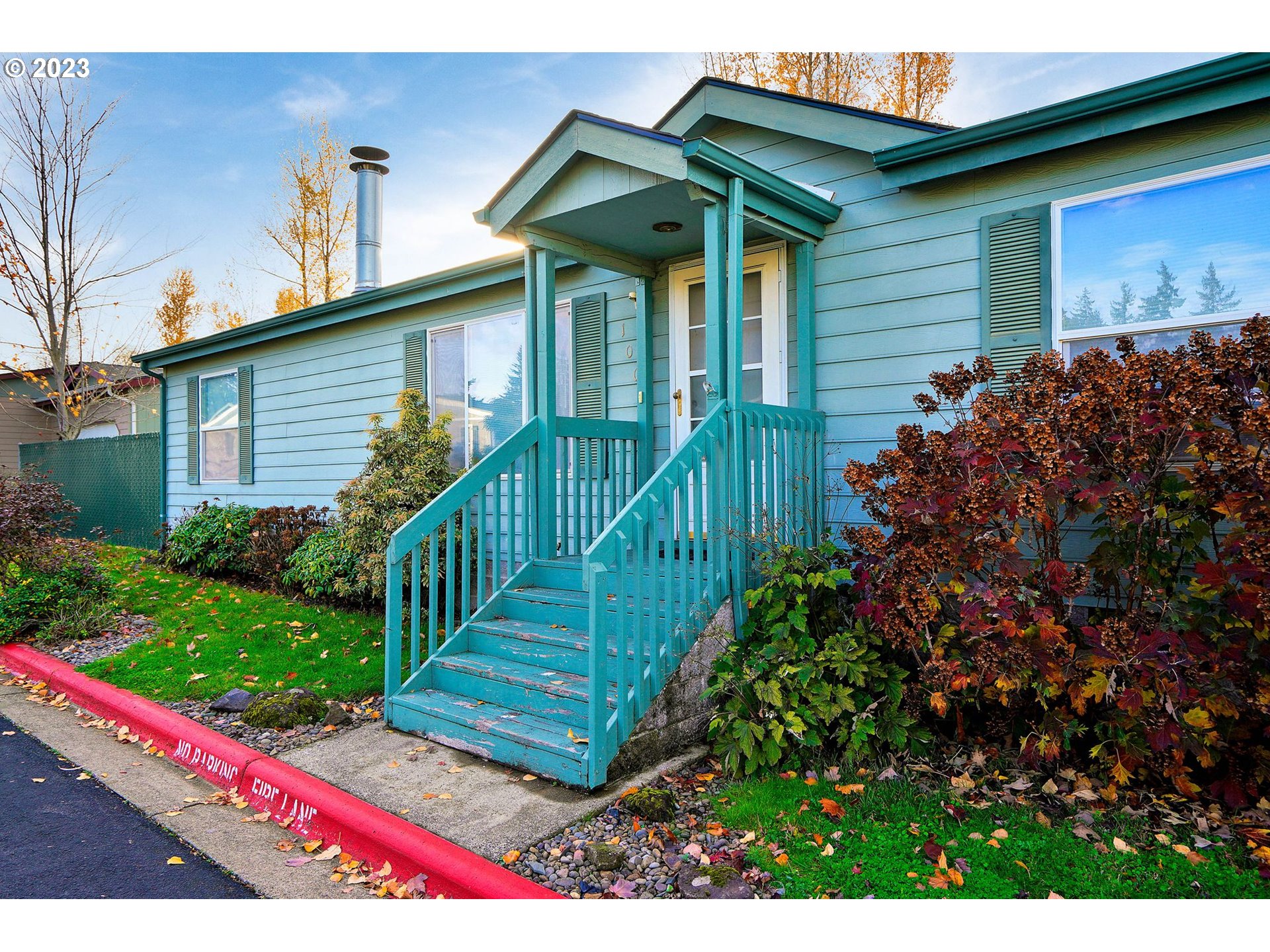 1015 Oak Street, Unit 100 Silverton, OR 97381 - Photo 1 of 30 a view of a house with wooden fence