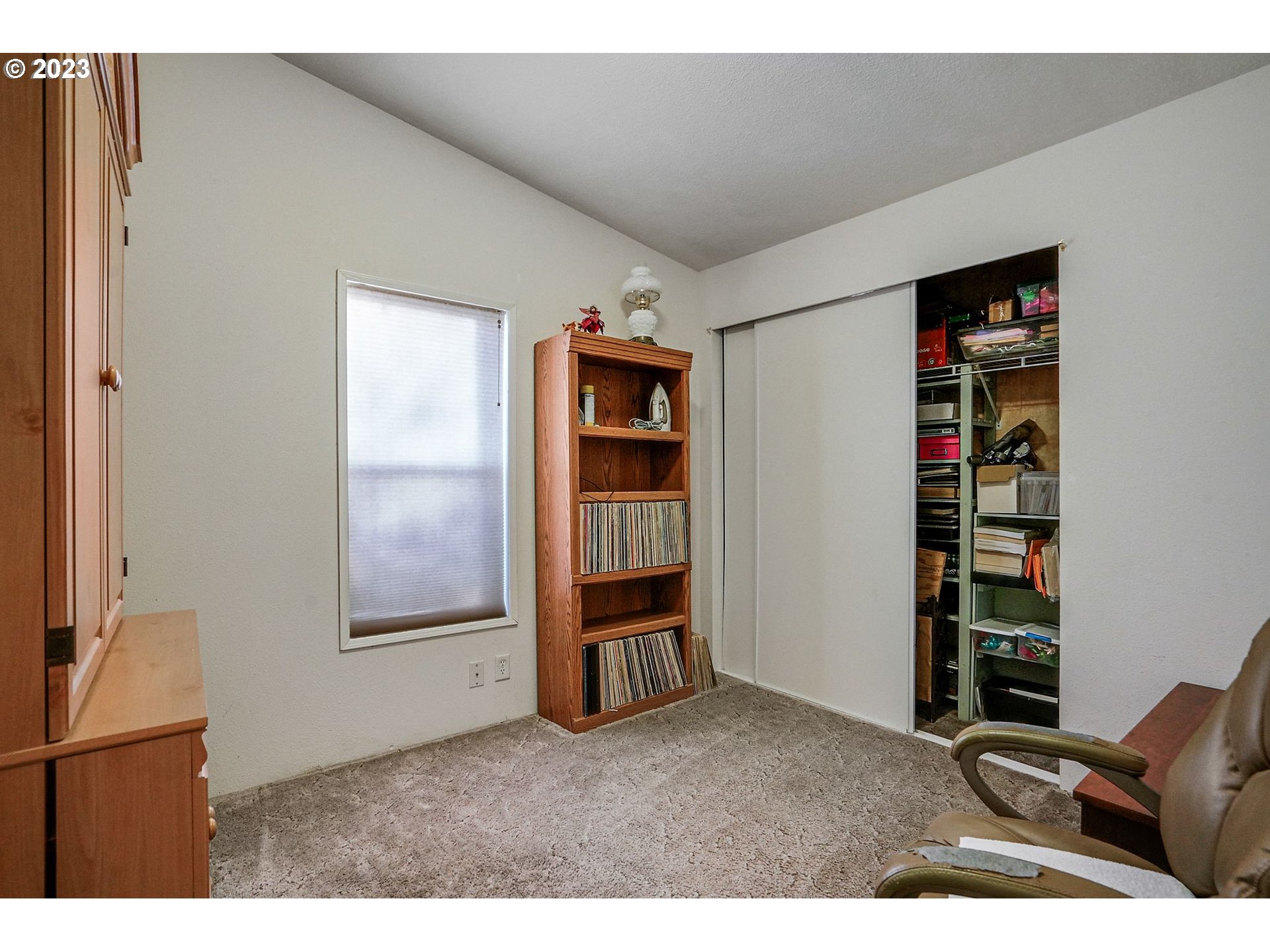 1015 Oak Street, Unit 100 Silverton, OR 97381 - Photo 14 of 30 a living room with furniture cabinets and window