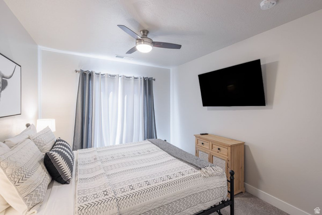 4845 Fishers Is Way St. George, UT 84770 - Photo 11 of 41 Bedroom with light carpet and ceiling fan
