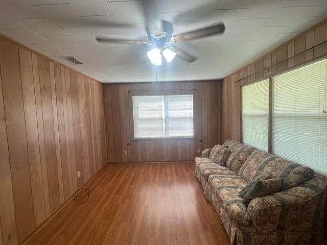 a living room with furniture and a window