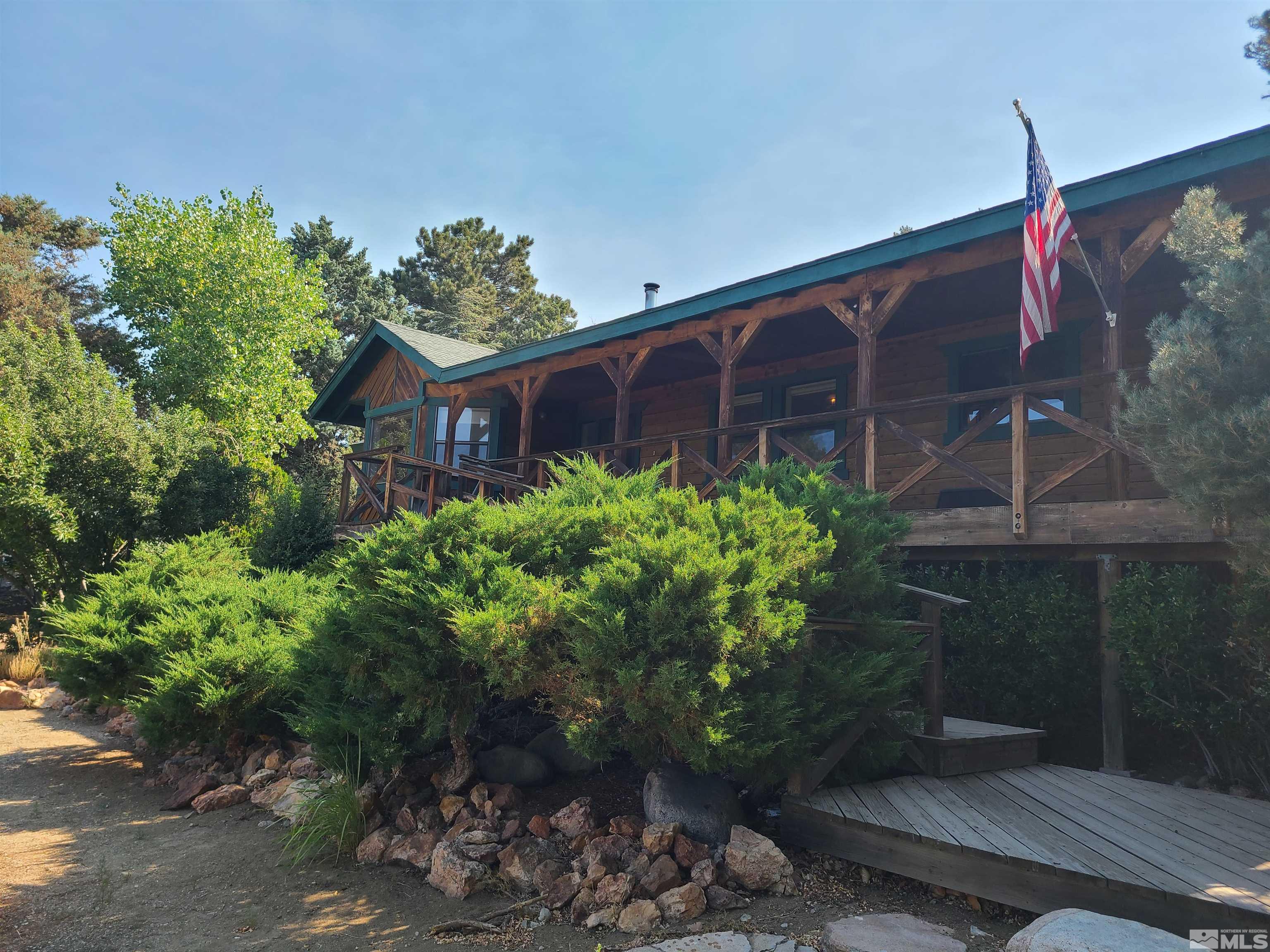 14460 Virginia Foothills Drive Reno, NV 89521 - Photo 1 of 17 a flower plants with wooden fence