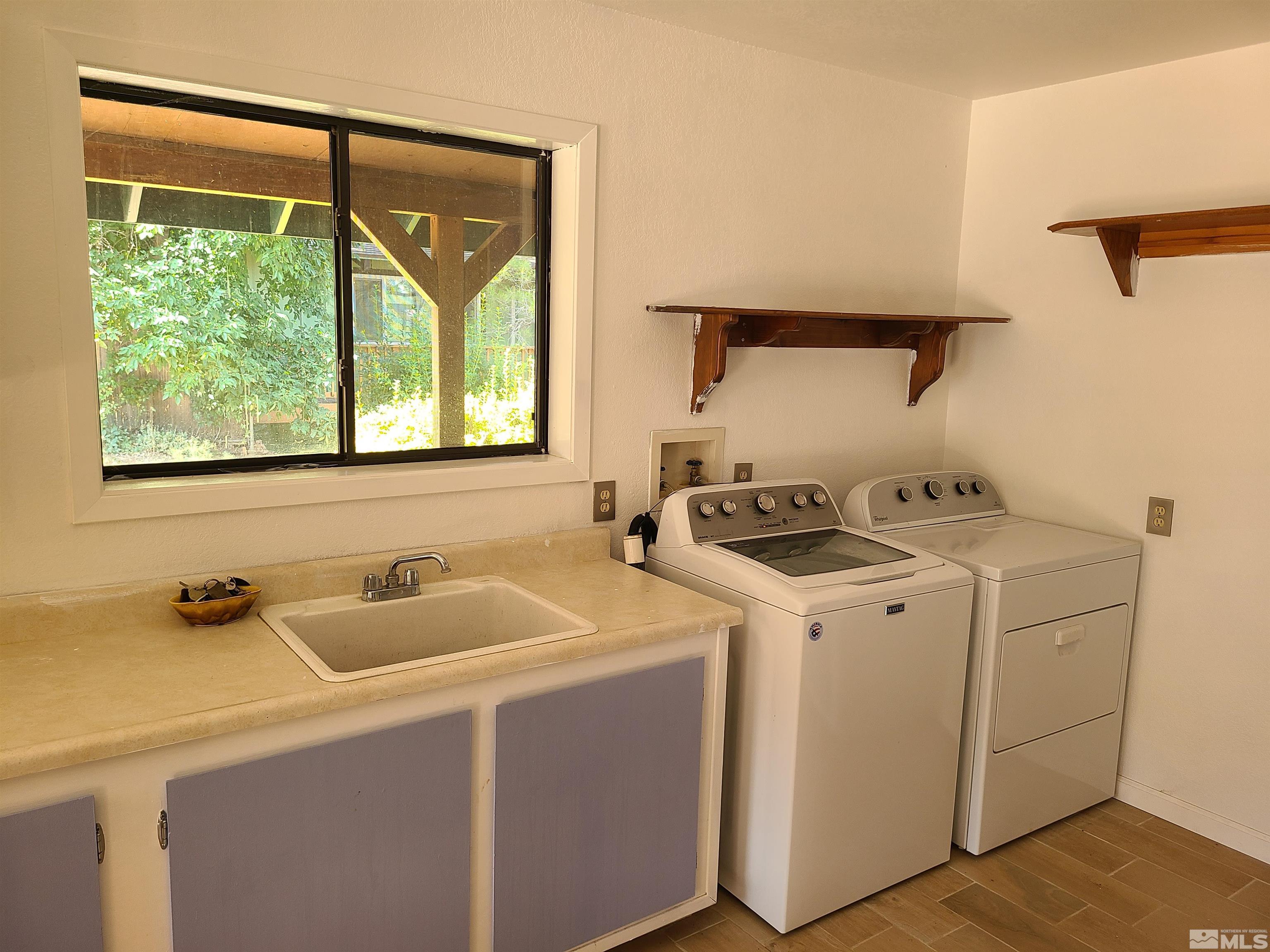 14460 Virginia Foothills Drive Reno, NV 89521 - Photo 13 of 17 a utility room with dryer and washer