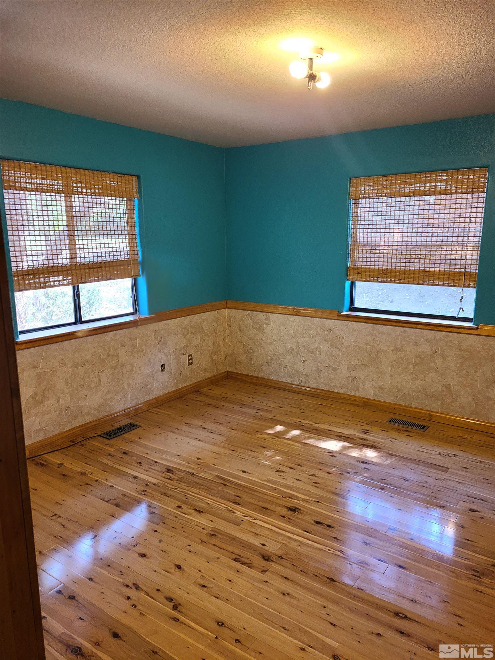 14460 Virginia Foothills Drive Reno, NV 89521 - Photo 10 of 17 a view of a room with wooden floor and a window