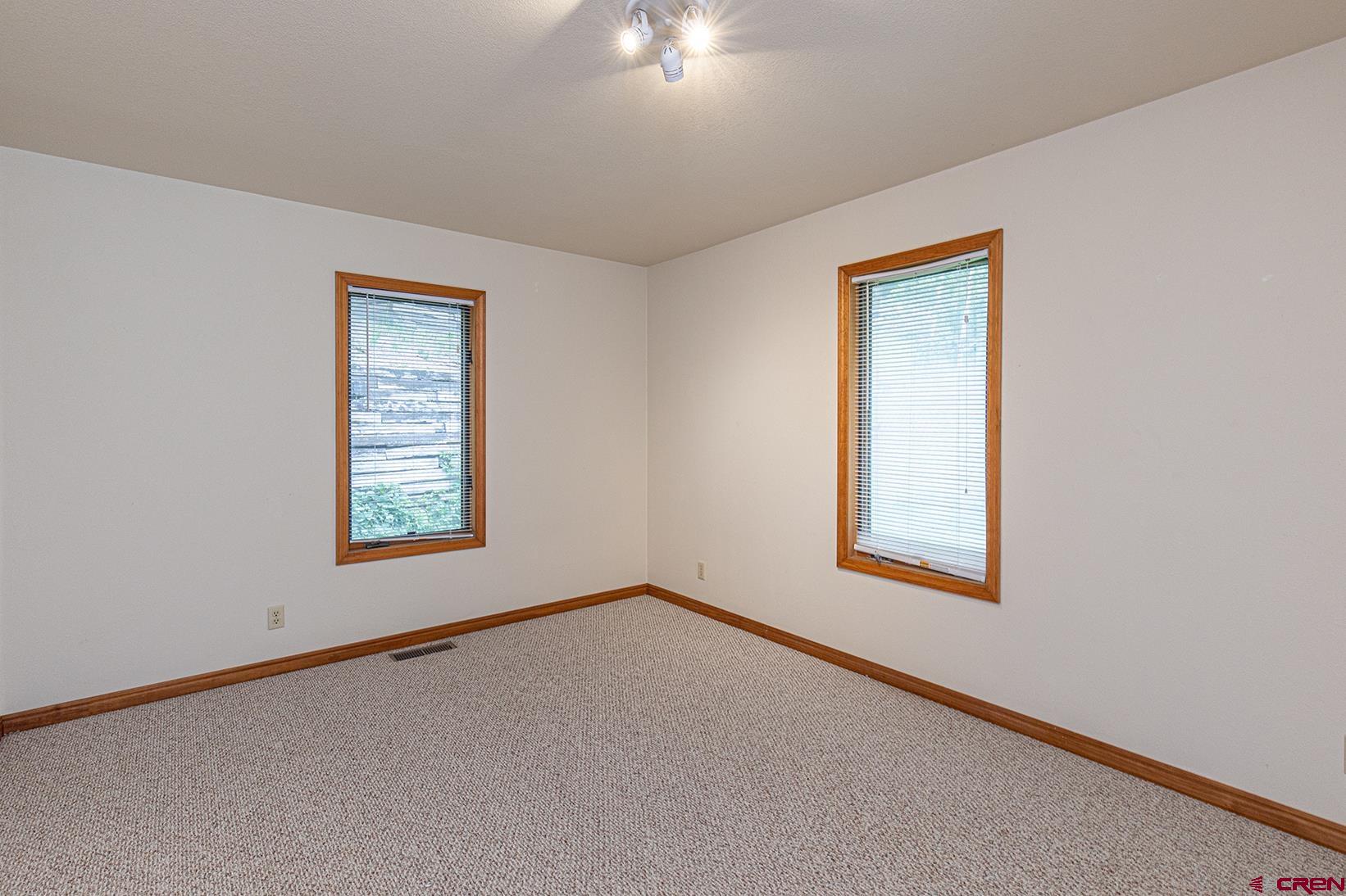 499 High Trails Drive Durango, CO 81301 - Photo 12 of 31 an empty room with a window