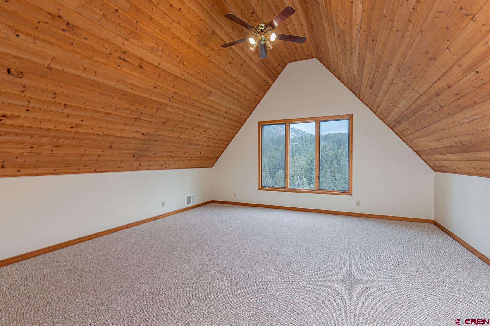 499 High Trails Drive Durango, CO 81301 - Photo 15 of 31 a view of an empty room with a window