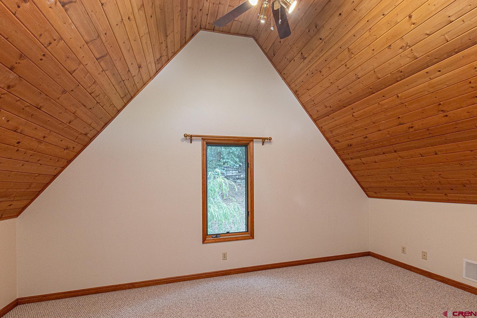 499 High Trails Drive Durango, CO 81301 - Photo 17 of 31 a view of a wooden floor in an empty room