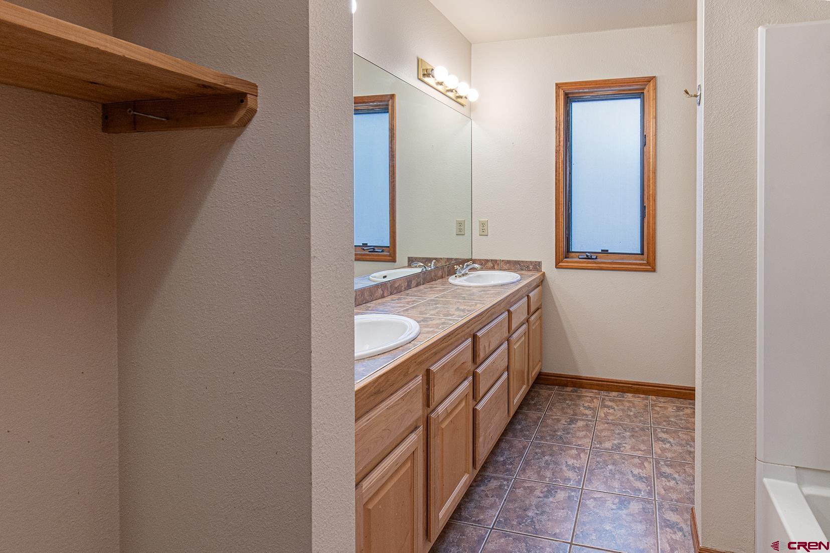 499 High Trails Drive Durango, CO 81301 - Photo 21 of 31 a bathroom with sink and mirror