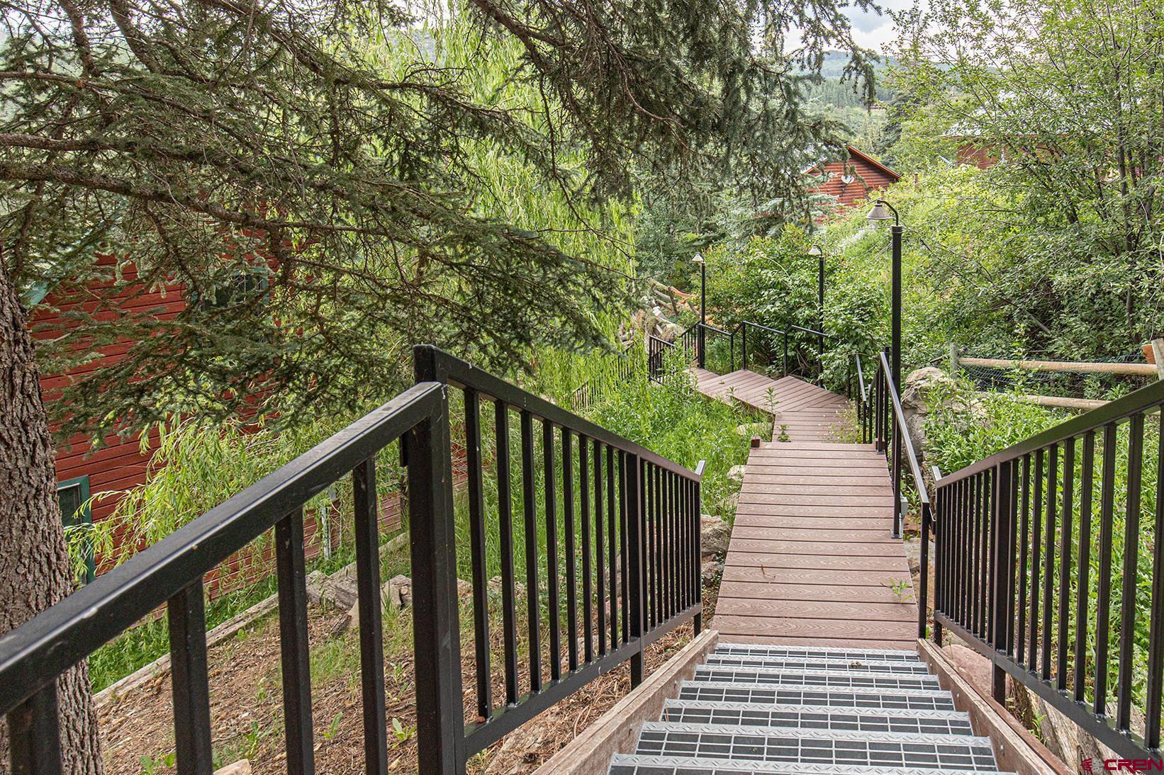 499 High Trails Drive Durango, CO 81301 - Photo 23 of 31 a view of a balcony with wooden fence and floor