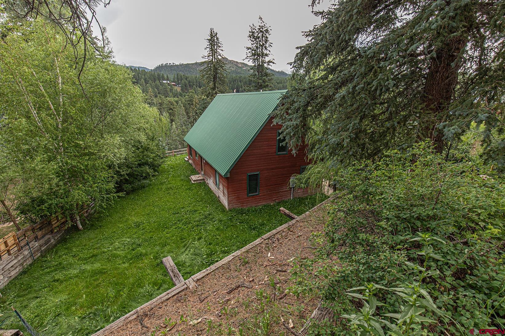 499 High Trails Drive Durango, CO 81301 - Photo 27 of 31 a view of a garden with a backyard
