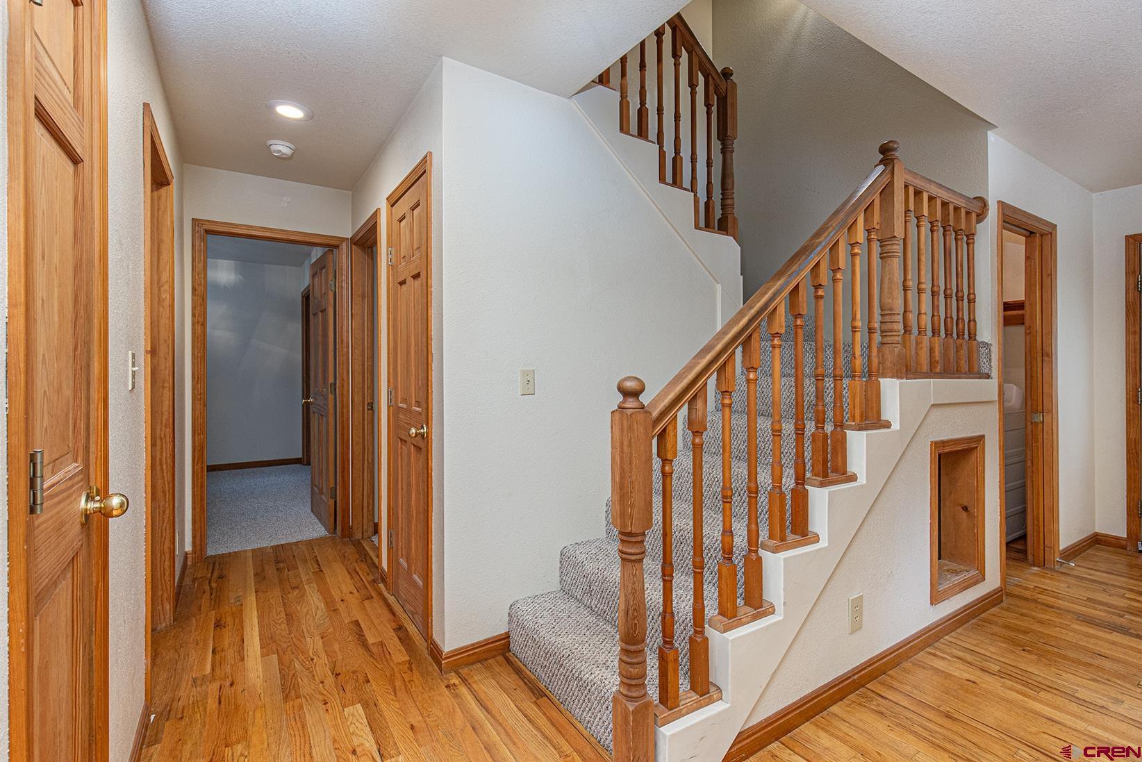 499 High Trails Drive Durango, CO 81301 - Photo 10 of 31 a view of staircase with wooden floor and stairs