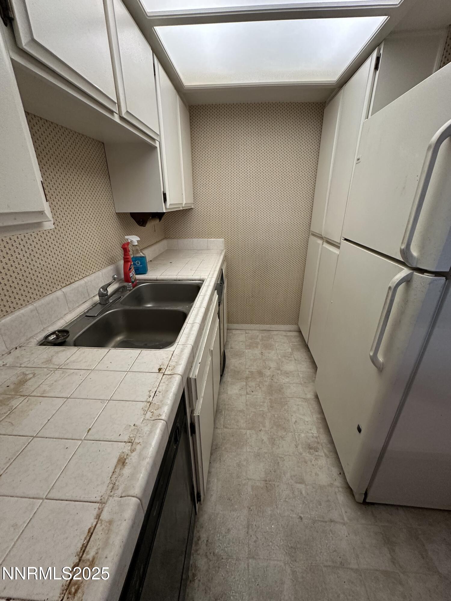 333 Ski Way, Unit 253 Incline Village, NV 89451 - Photo 6 of 13 a kitchen with a sink and cabinets