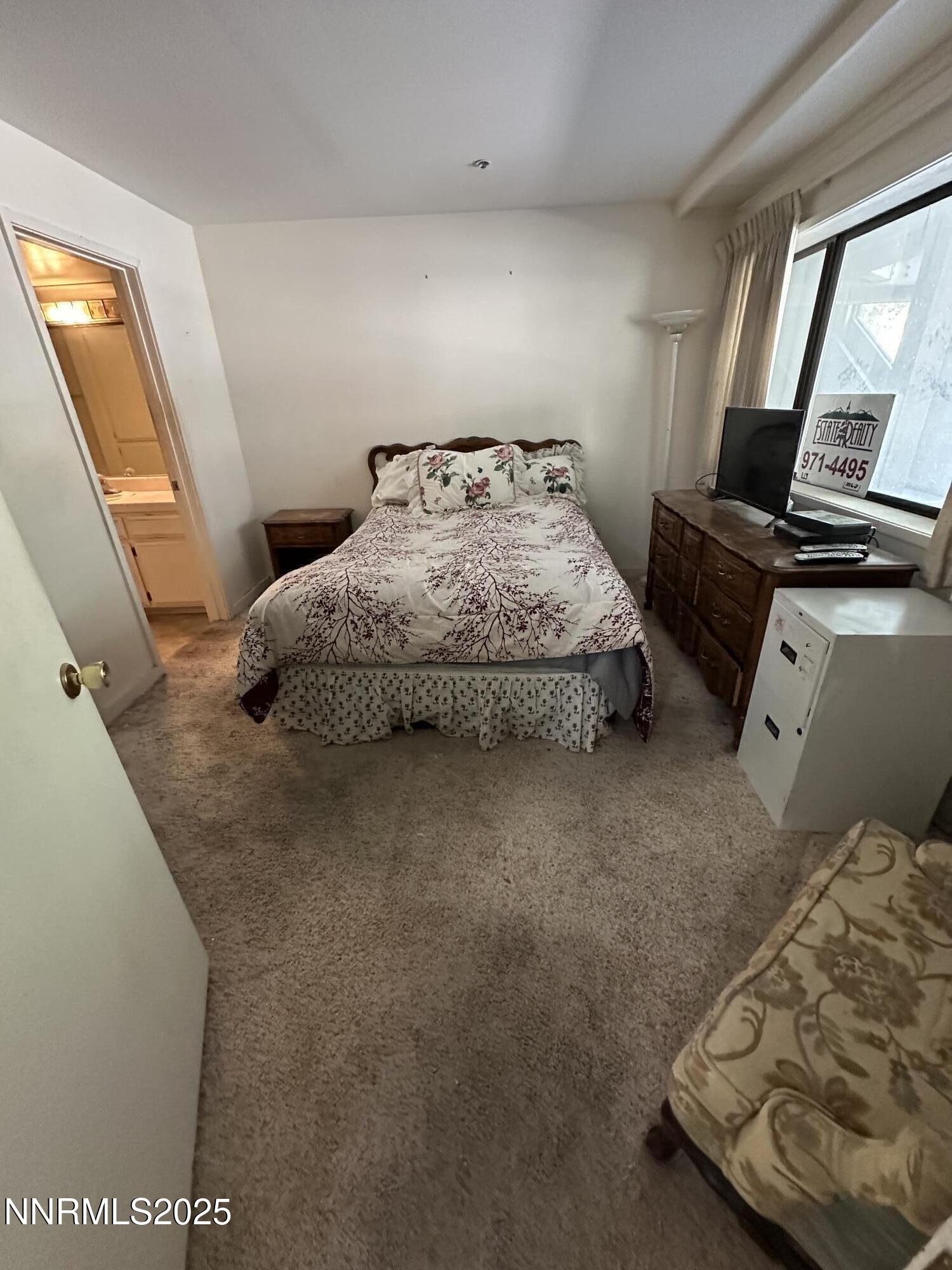 333 Ski Way, Unit 253 Incline Village, NV 89451 - Photo 8 of 13 a bedroom with a bed and wooden floor