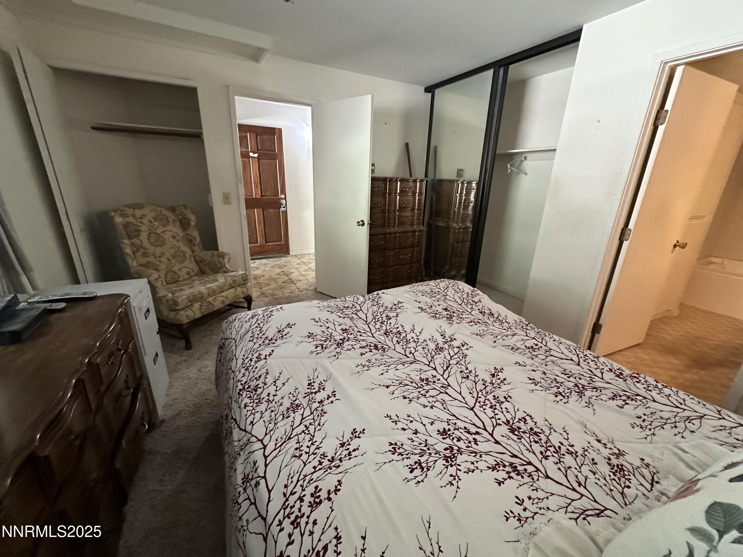 333 Ski Way, Unit 253 Incline Village, NV 89451 - Photo 9 of 13 a bedroom with a bed and wooden floor