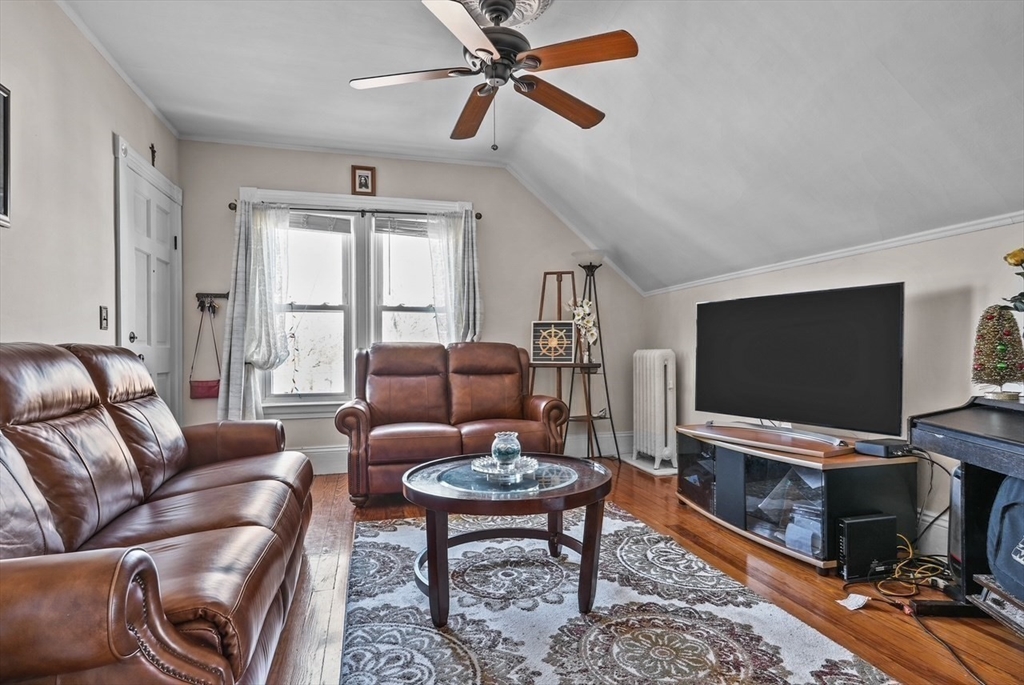 42 Pleasant Street, Unit C North Attleboro, MA 02760 - Photo 11 of 16 a living room with furniture and a flat screen tv