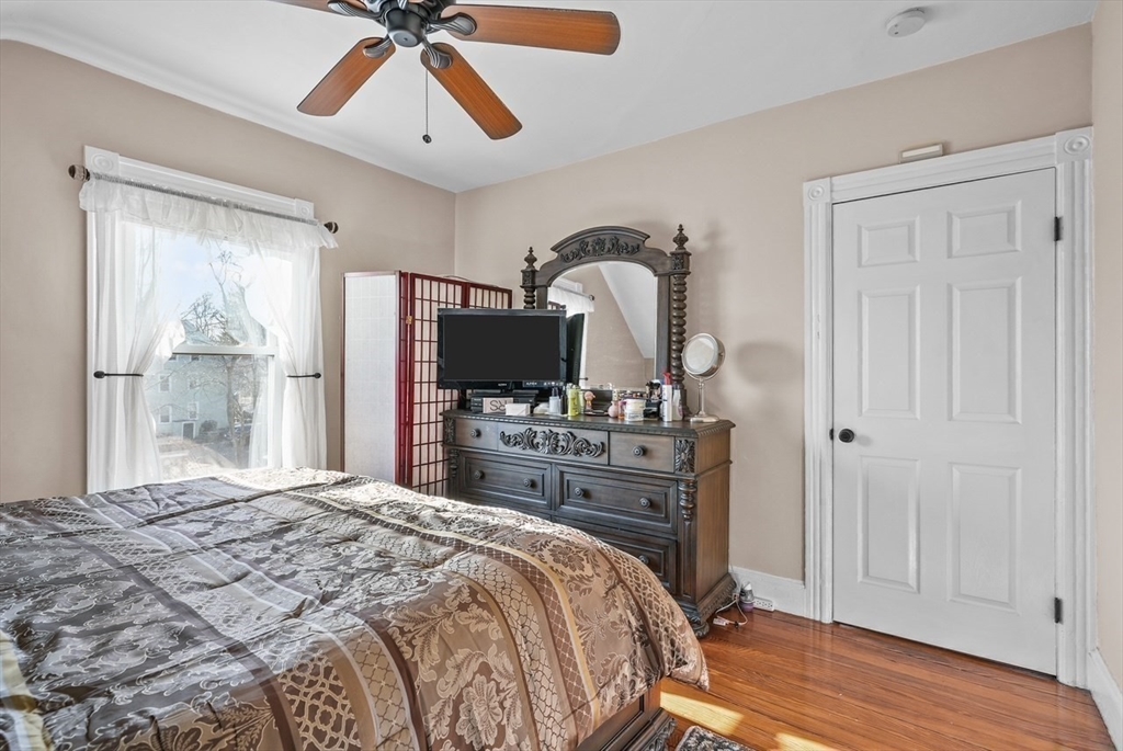 42 Pleasant Street, Unit C North Attleboro, MA 02760 - Photo 16 of 16 a bedroom with a bed and a flat screen tv