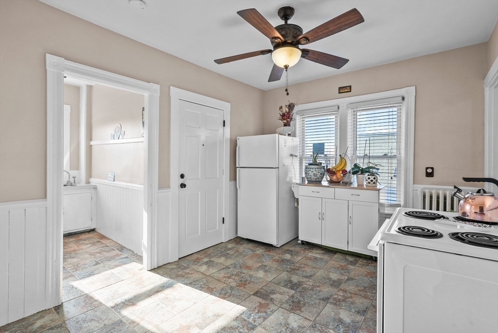 42 Pleasant Street, Unit C North Attleboro, MA 02760 - Photo 5 of 16 a room that has a bed and a refrigerator in it