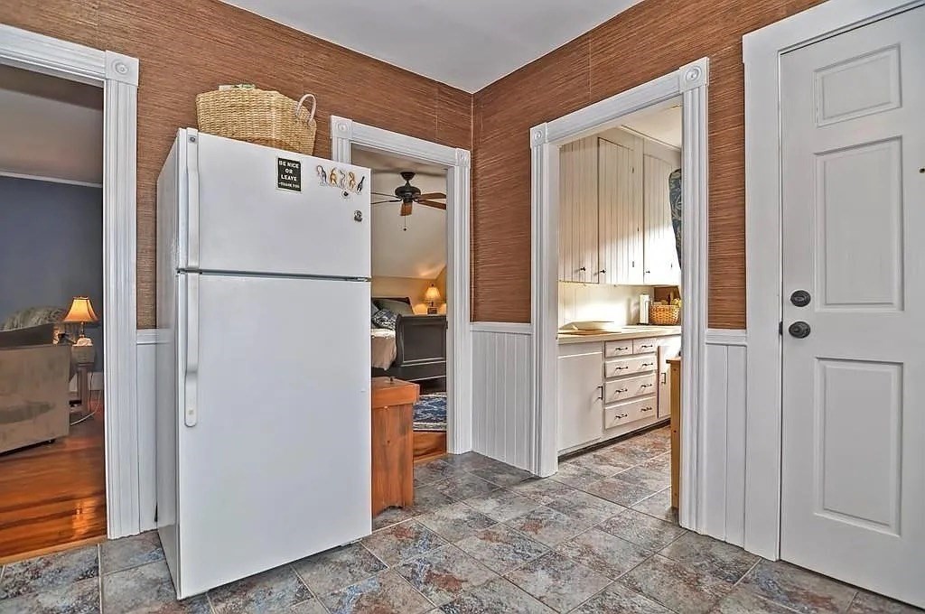 42 Pleasant Street, Unit C North Attleboro, MA 02760 - Photo 6 of 16 a view of a kitchen with refrigerator and cabinet