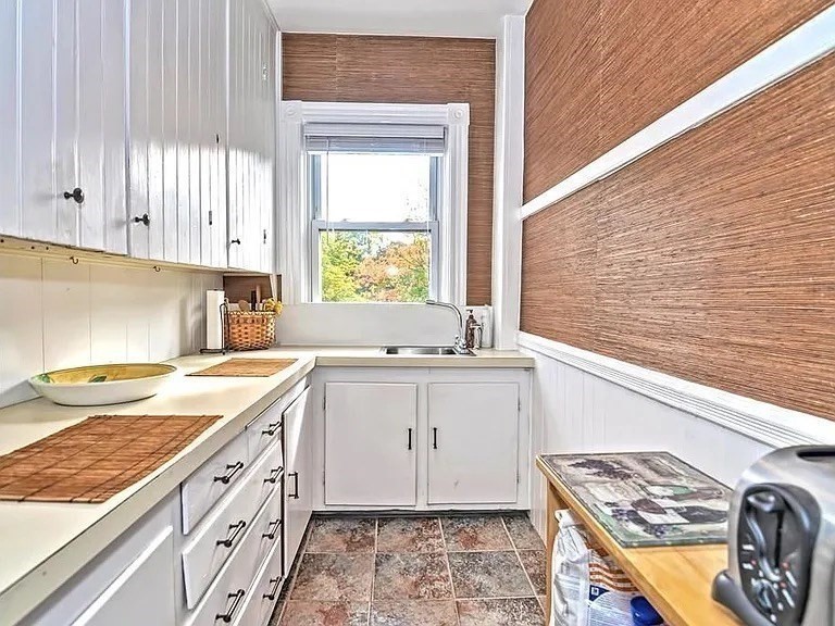 42 Pleasant Street, Unit C North Attleboro, MA 02760 - Photo 7 of 16 a kitchen with a sink stove and cabinets