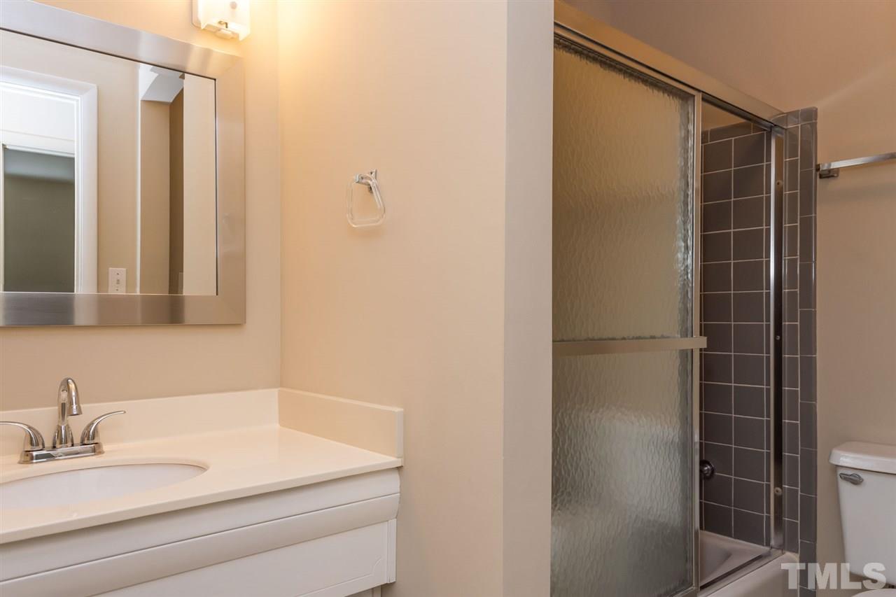 500 Pinecroft Drive Raleigh, NC 27609 - Photo 11 of 21 a bathroom with a sink and a mirror