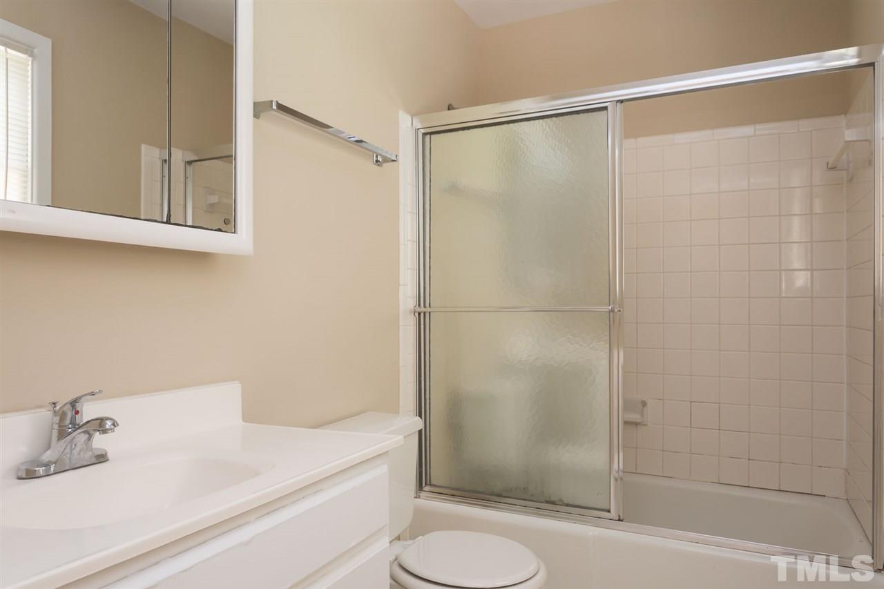 500 Pinecroft Drive Raleigh, NC 27609 - Photo 14 of 21 a bathroom with a sink and a mirror