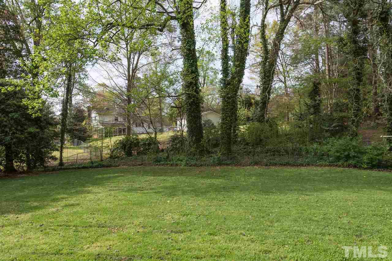 500 Pinecroft Drive Raleigh, NC 27609 - Photo 20 of 21 a view of a field of grass and trees
