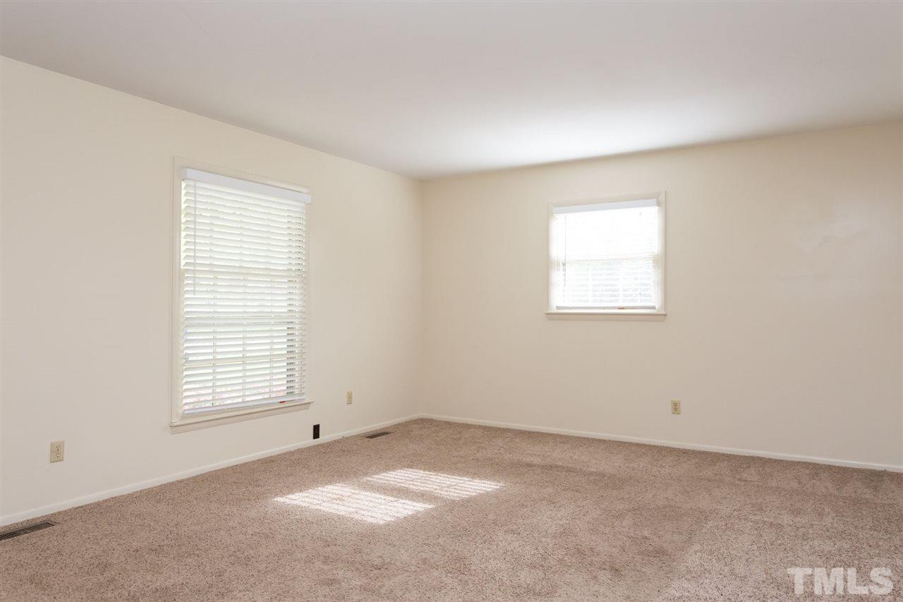 500 Pinecroft Drive Raleigh, NC 27609 - Photo 6 of 21 an empty room with a window