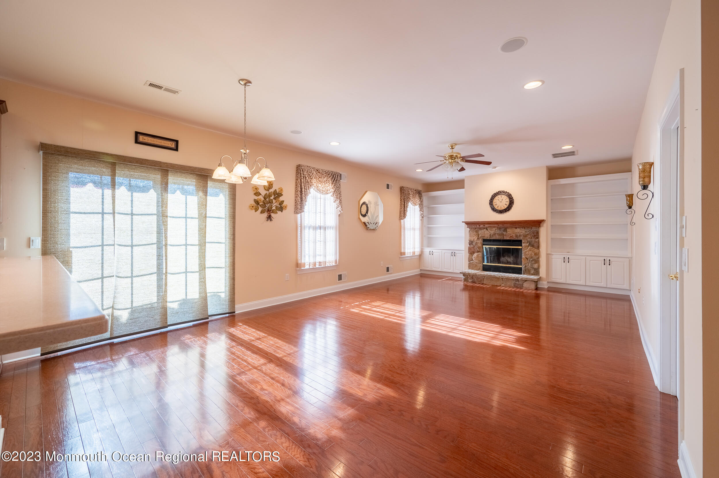 2 Springdale Road Manchester Township, NJ 08759 - Photo 17 of 37 a view of livingroom with window fireplace and wooden floor