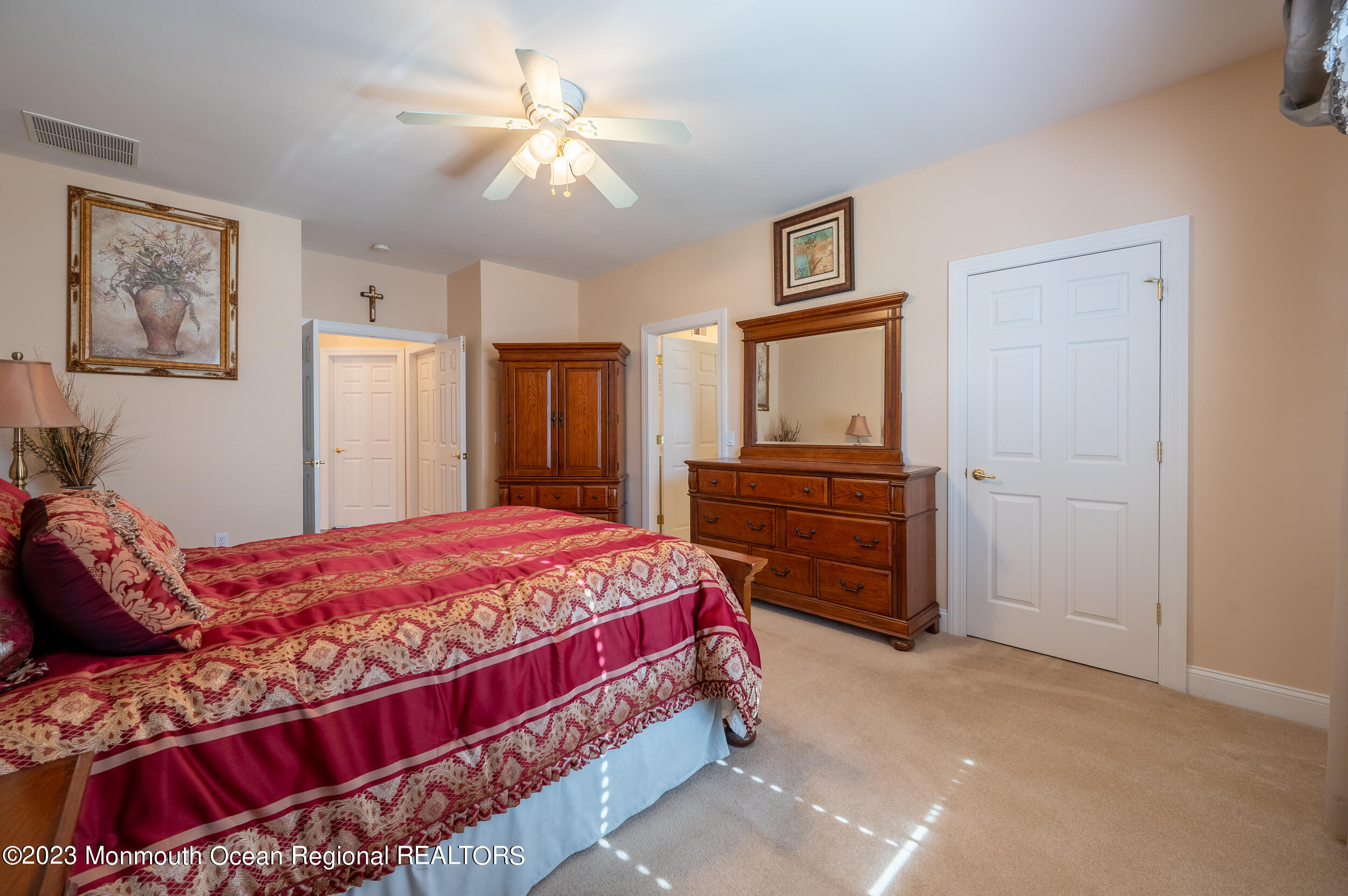 2 Springdale Road Manchester Township, NJ 08759 - Photo 27 of 37 a bedroom with a bed and a chandelier