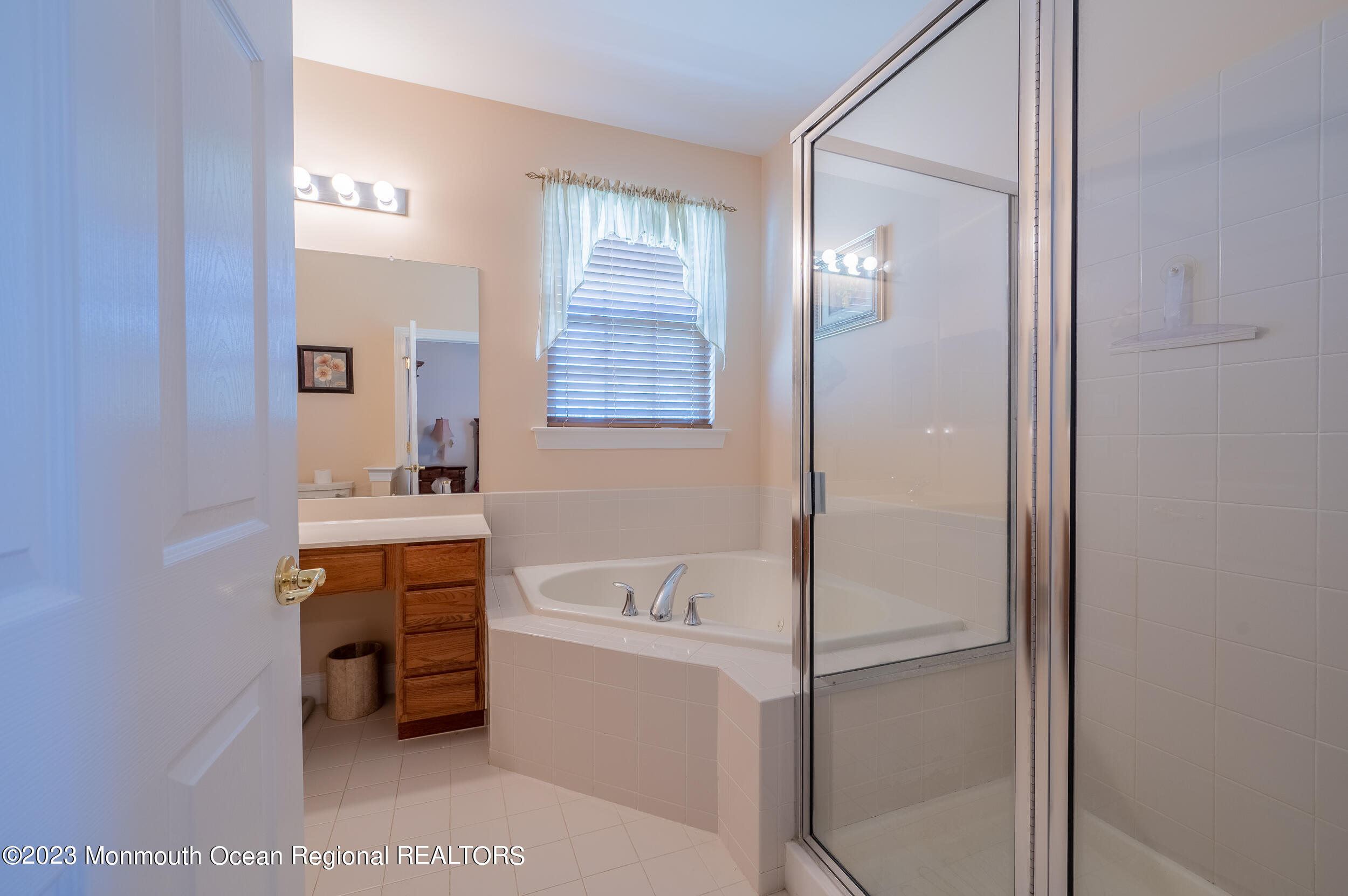 2 Springdale Road Manchester Township, NJ 08759 - Photo 29 of 37 a bathroom with a tub sink and mirror