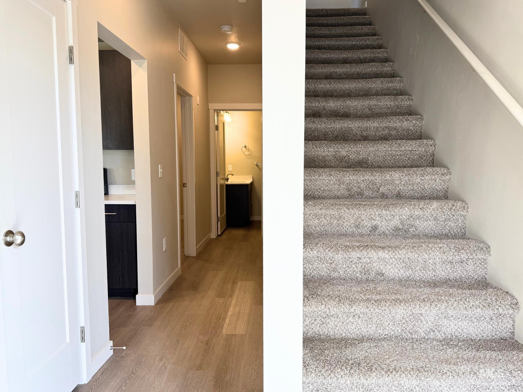 616 North 44th Street Nampa, ID 83687 - Photo 5 of 18 Staircase featuring wood finished floors and baseboards