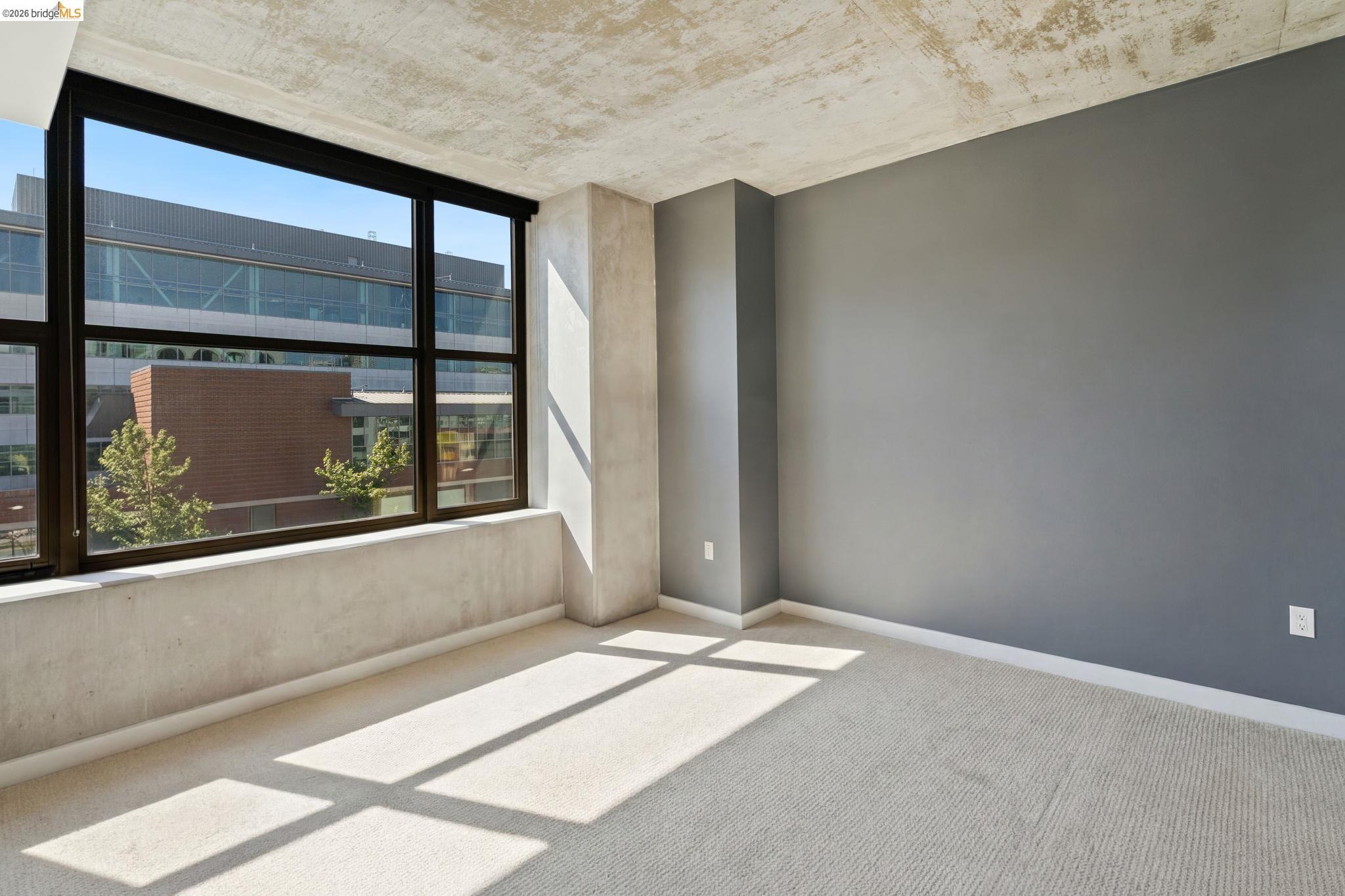 311 2nd Street, Unit 511 Oakland, CA 94607 - Photo 22 of 44 Empty room with light carpet and baseboards