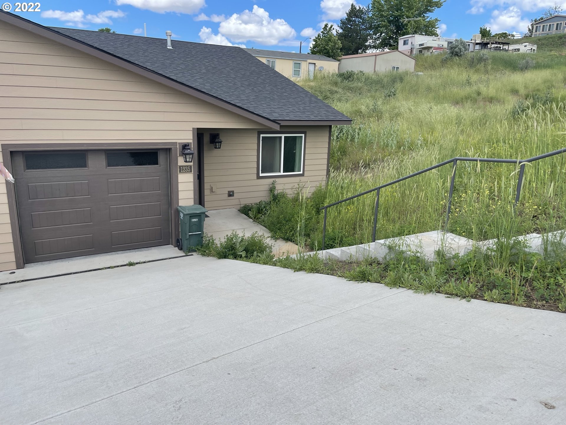 1235 Southwest 12th Street Pendleton, OR 97801 - Photo 1 of 17 a backyard of a house with lots of green space