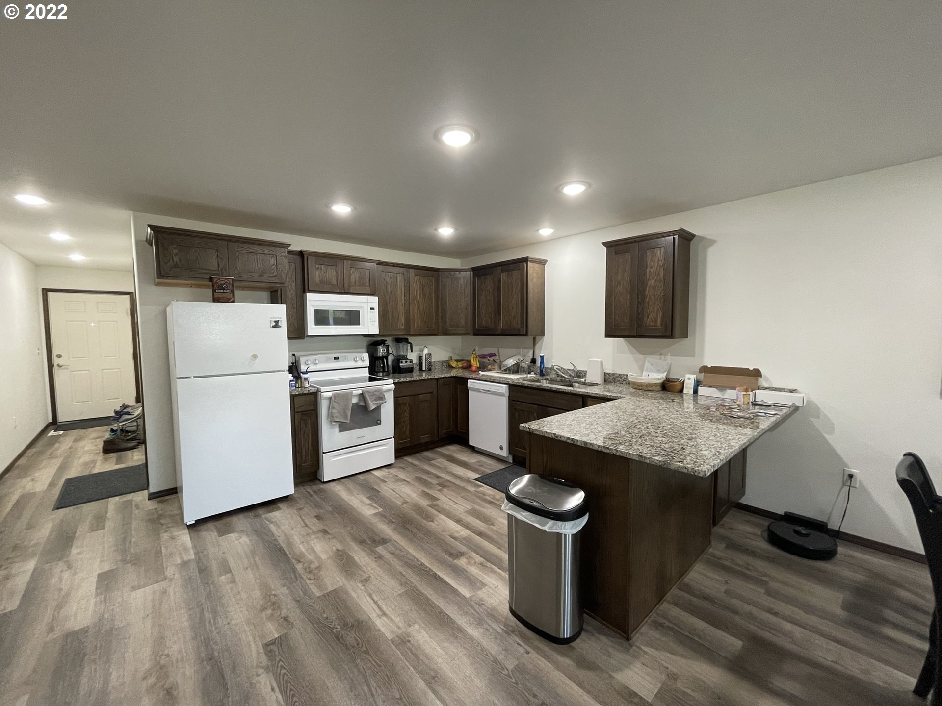 1235 Southwest 12th Street Pendleton, OR 97801 - Photo 5 of 17 a kitchen with a sink a counter top space stainless steel appliances and cabinets
