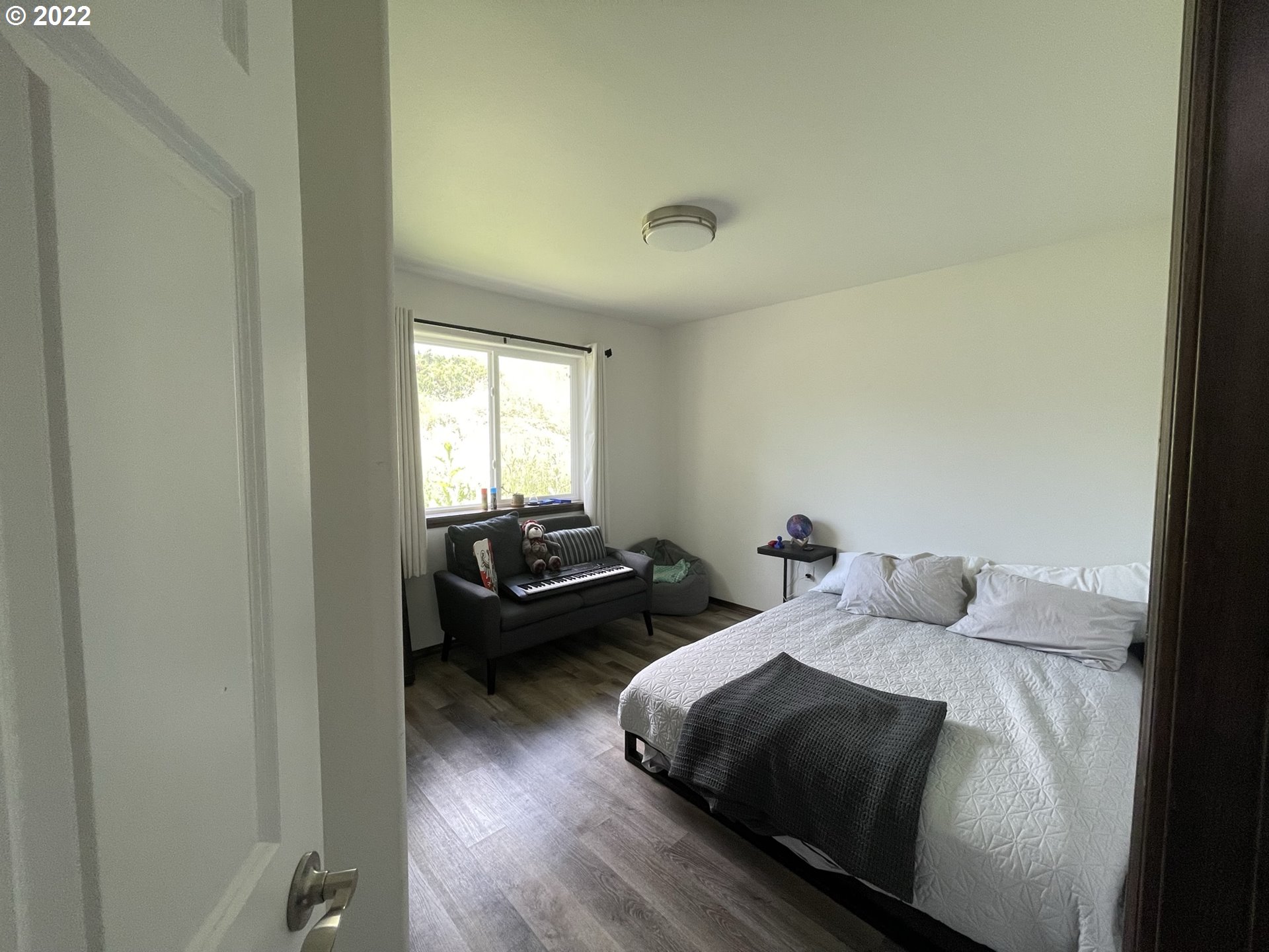 1235 Southwest 12th Street Pendleton, OR 97801 - Photo 7 of 17 a bedroom with two beds and wooden floor