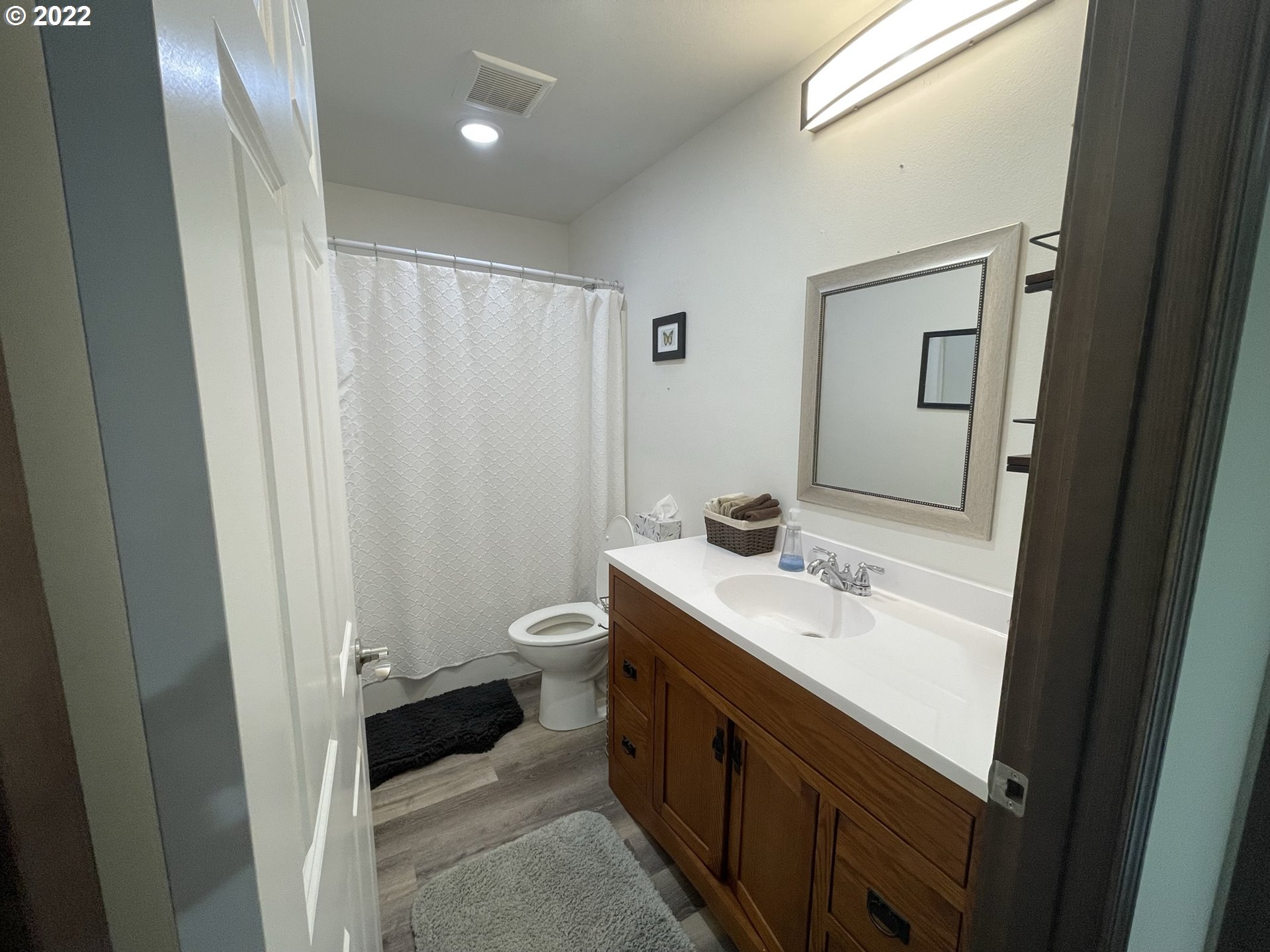 1235 Southwest 12th Street Pendleton, OR 97801 - Photo 9 of 17 a bathroom with a sink a toilet and mirror