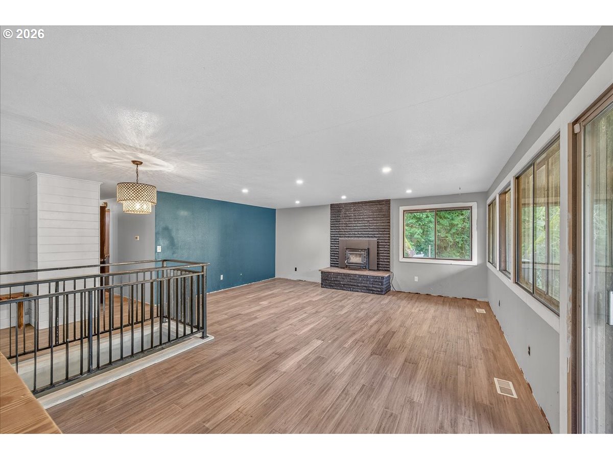 33320 Southeast Francis Street Gresham, OR 97080 - Photo 13 of 40 a view of an empty room with wooden floor
