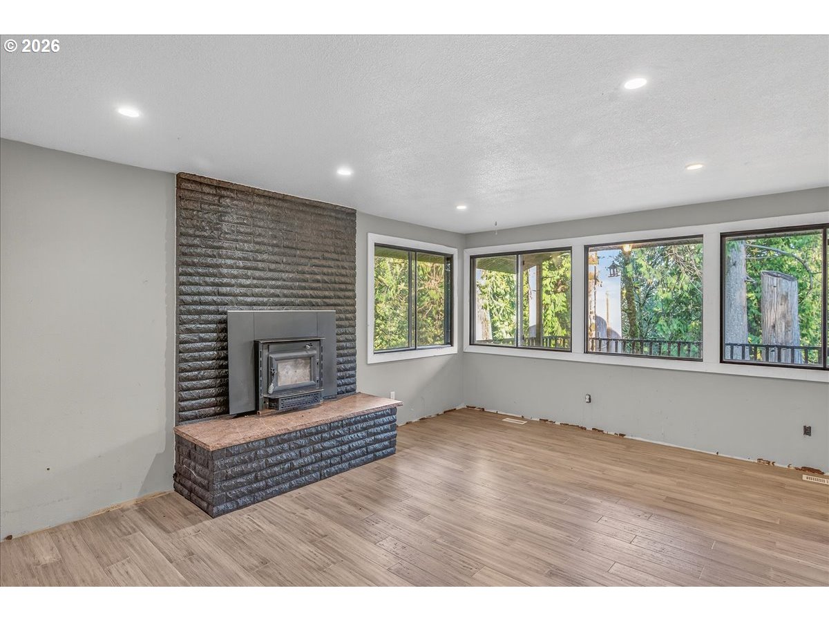 33320 Southeast Francis Street Gresham, OR 97080 - Photo 16 of 40 a living room with furniture and a fireplace