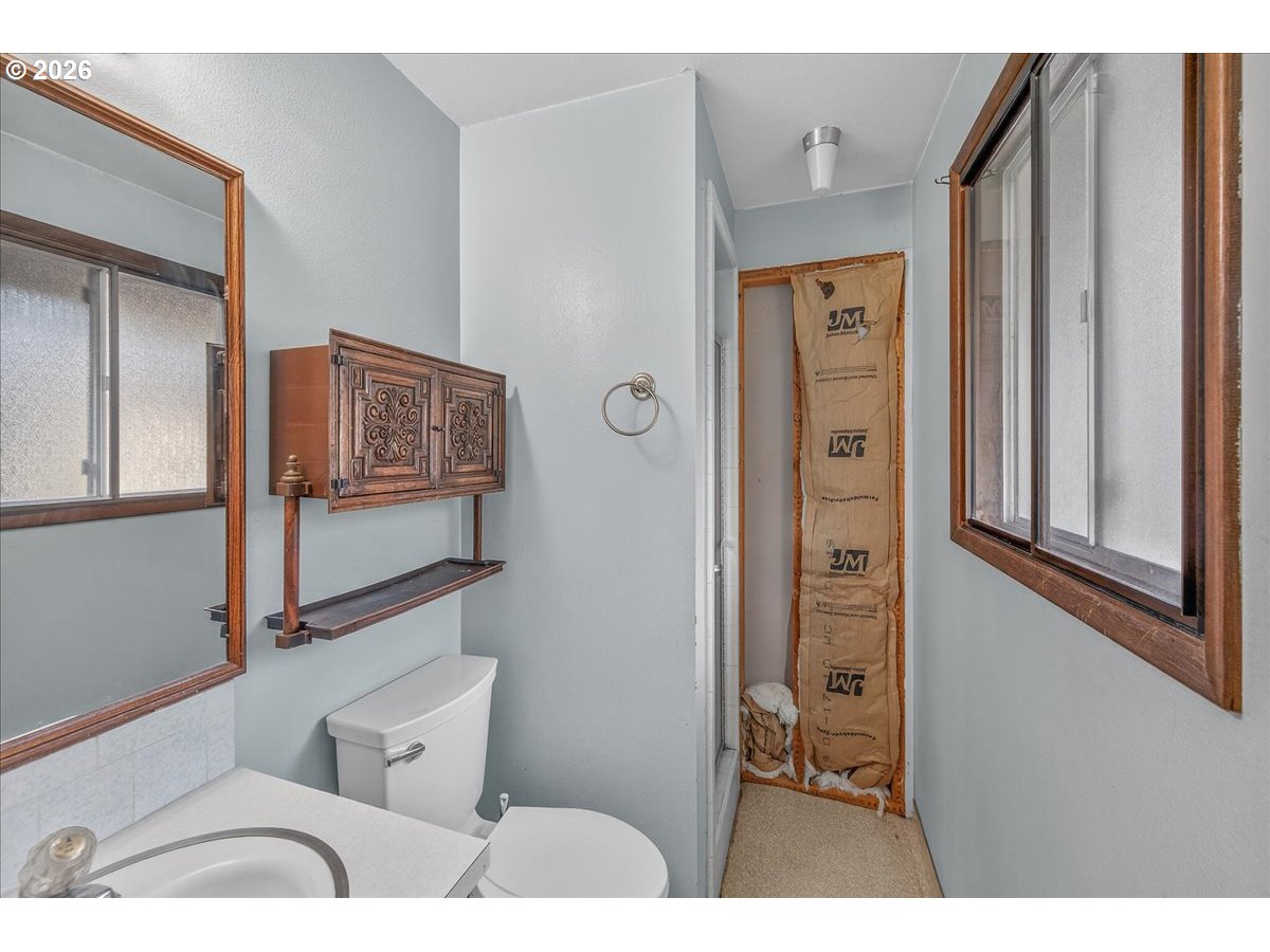 33320 Southeast Francis Street Gresham, OR 97080 - Photo 23 of 40 a living room with furniture and a window