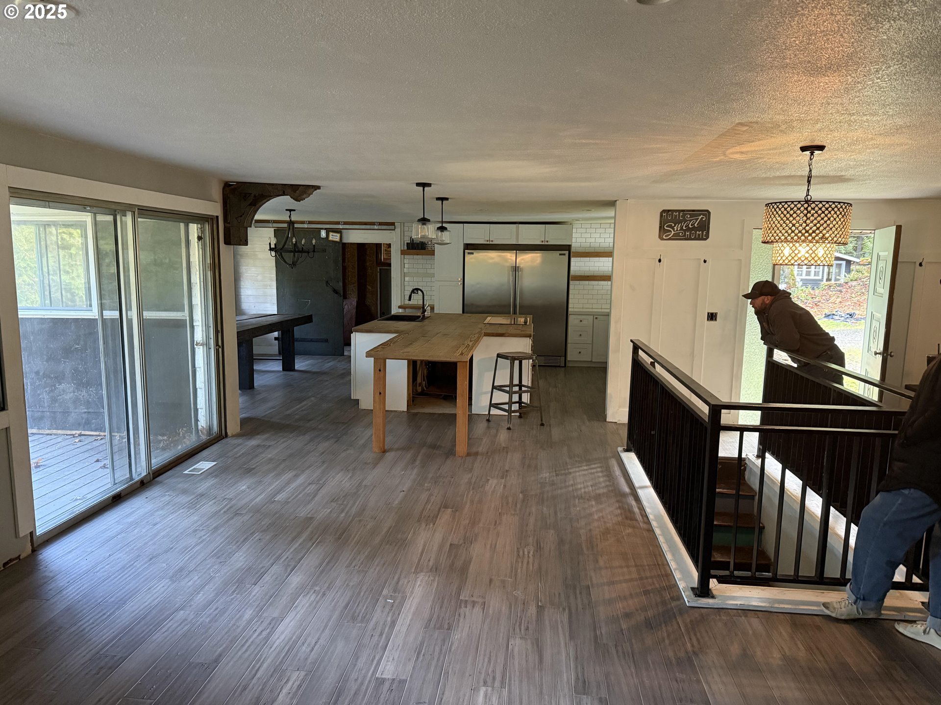 33320 Southeast Francis Street Gresham, OR 97080 - Photo 5 of 40 a view of a livingroom with furniture wooden floor staircase and kitchen view
