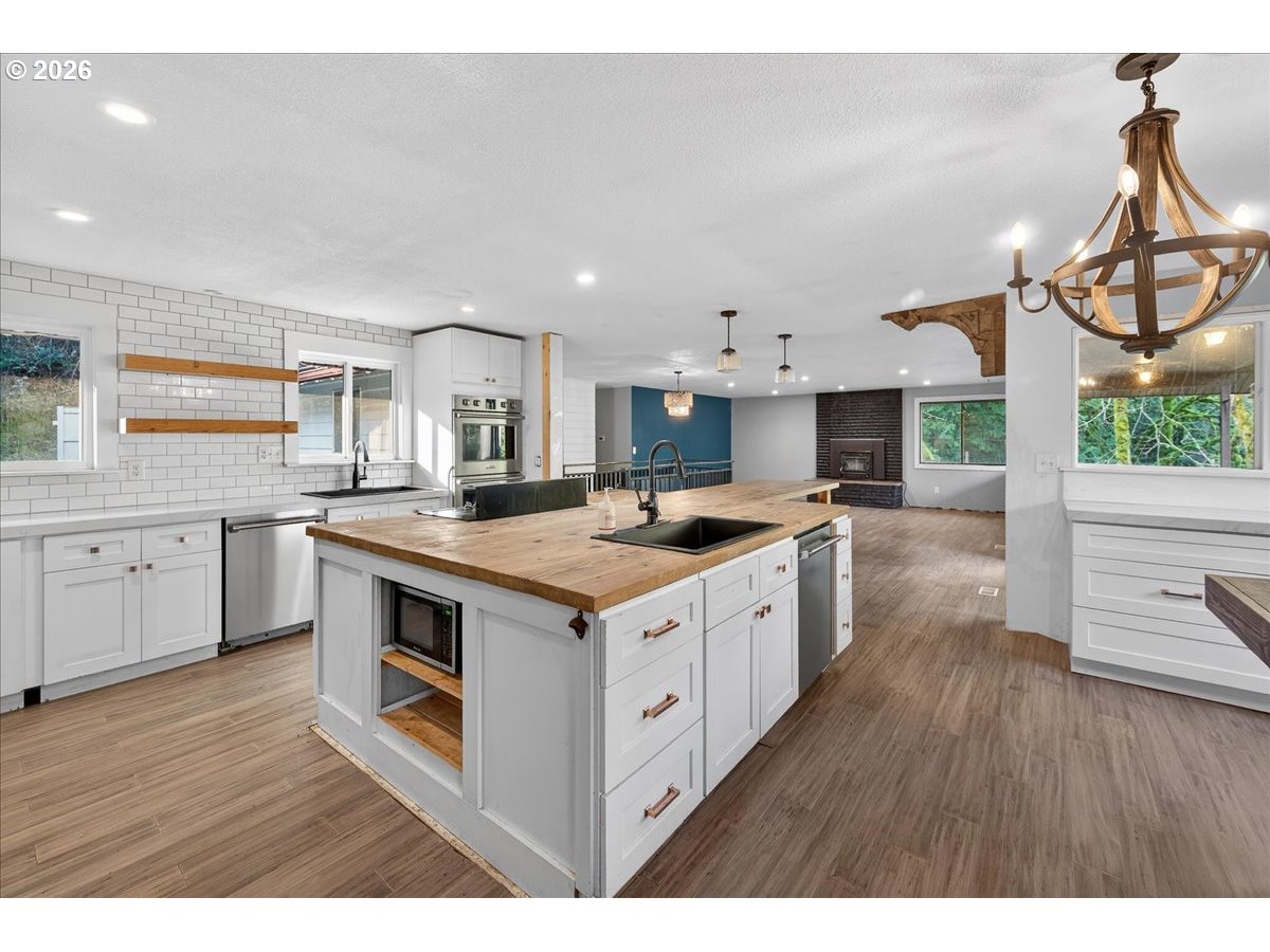 33320 Southeast Francis Street Gresham, OR 97080 - Photo 9 of 40 a kitchen with a sink stove and cabinets