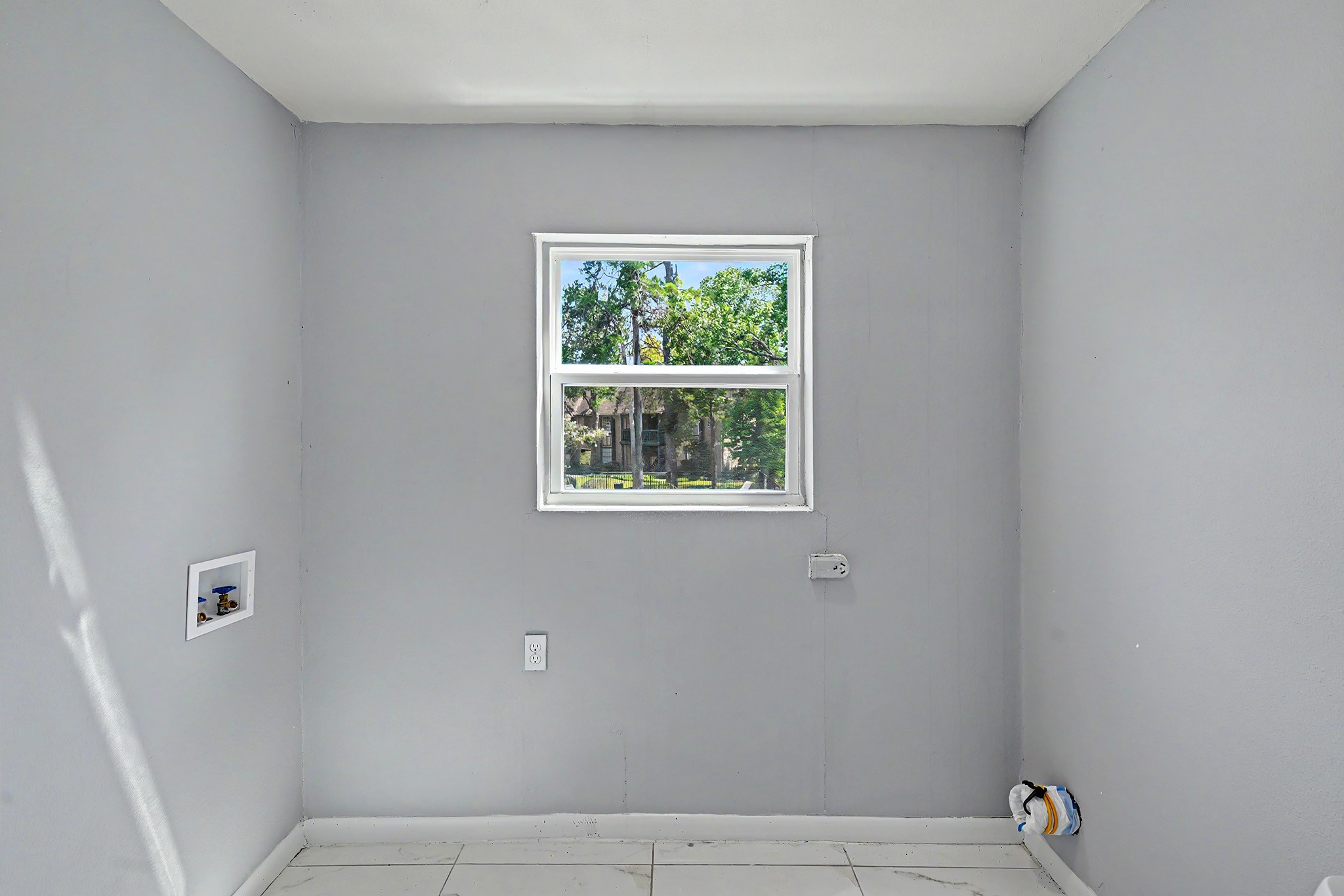 8211 Kingsbrook Road, Unit 205 Houston, TX 77024 - Photo 17 of 23 Laundry room with connections and window.