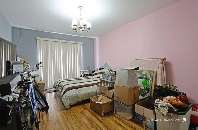 a view of a workspace with furniture and a chandelier