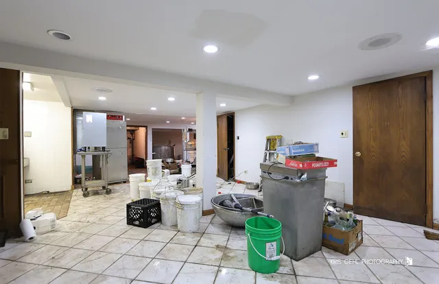 a view of kitchen with refrigerator and window