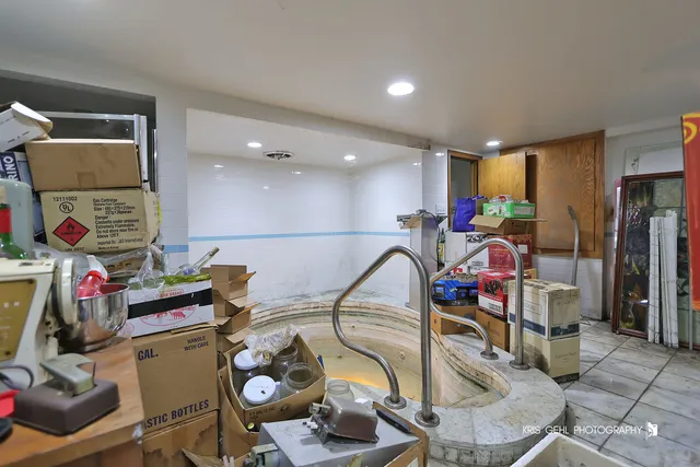 a kitchen with stainless steel appliances granite countertop a sink and cabinets