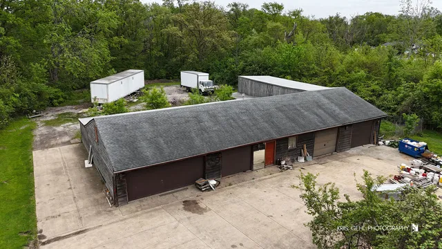 an aerial view of a house with outdoor space garden and lake view