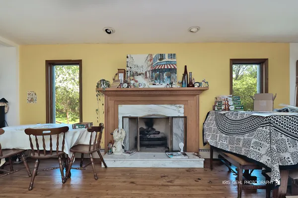 a kitchen with a sink window and cabinets
