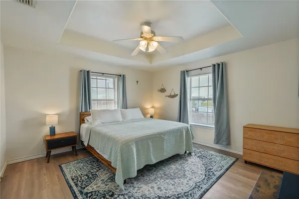 a bedroom with a bed and window