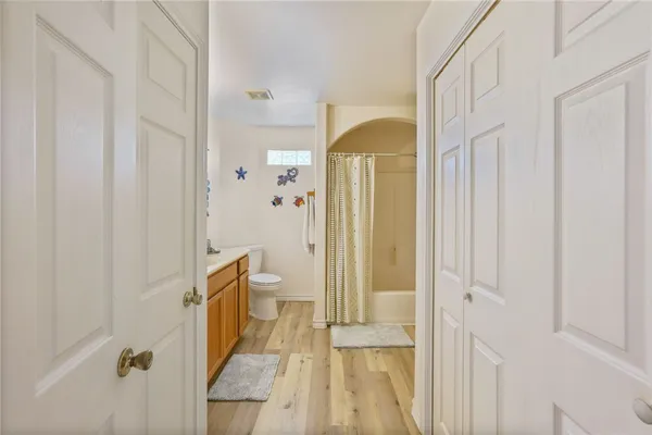 a bathroom with a tub and shower
