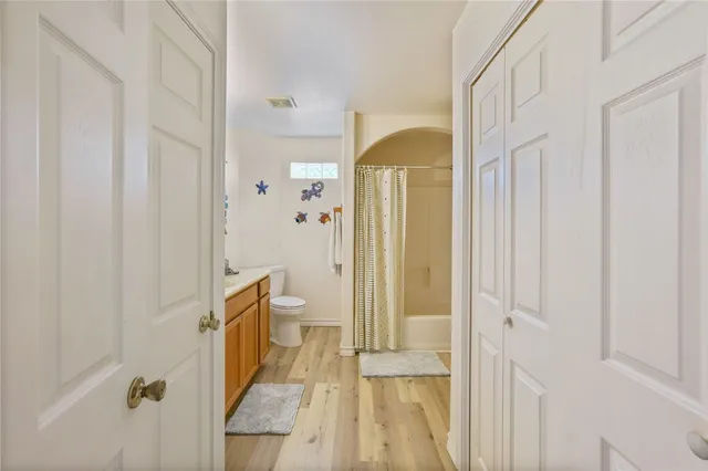 a bathroom with a tub and shower