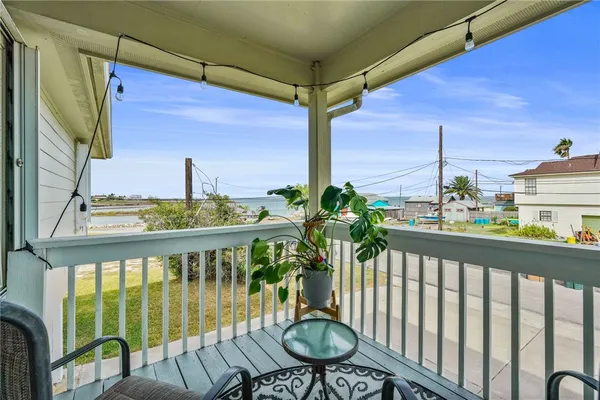 a view of a balcony with chairs